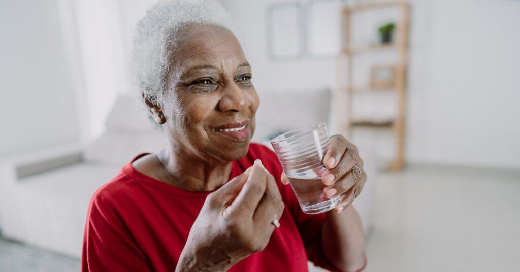 woman taking pill